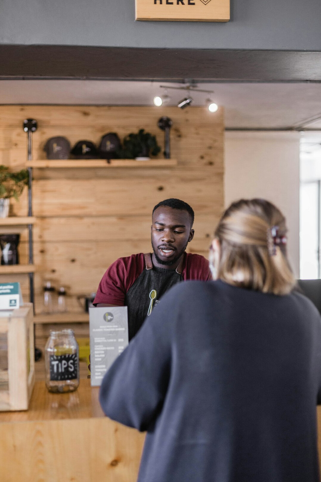 retail employee greeting customer