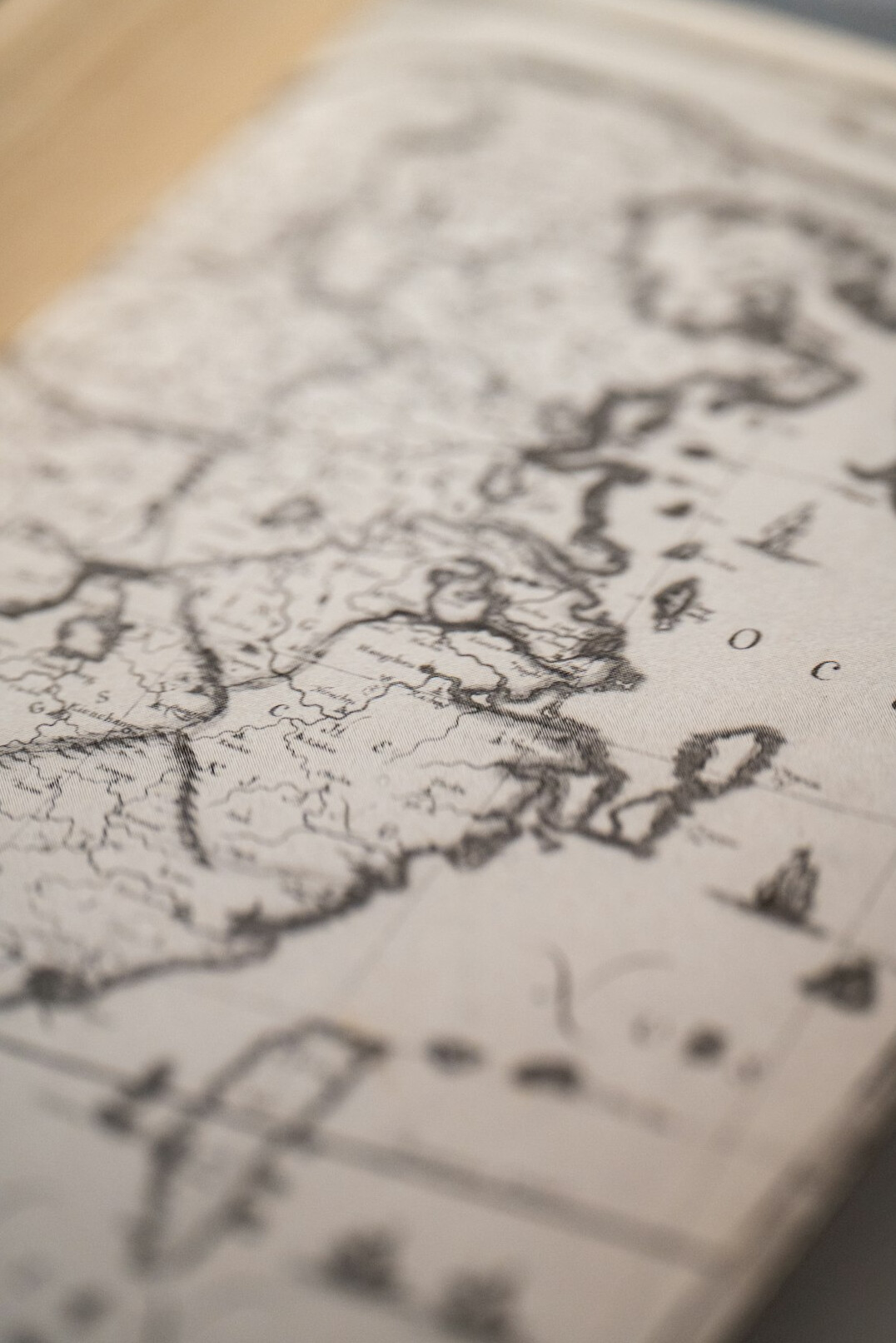 Old folded paper map on a wooden table