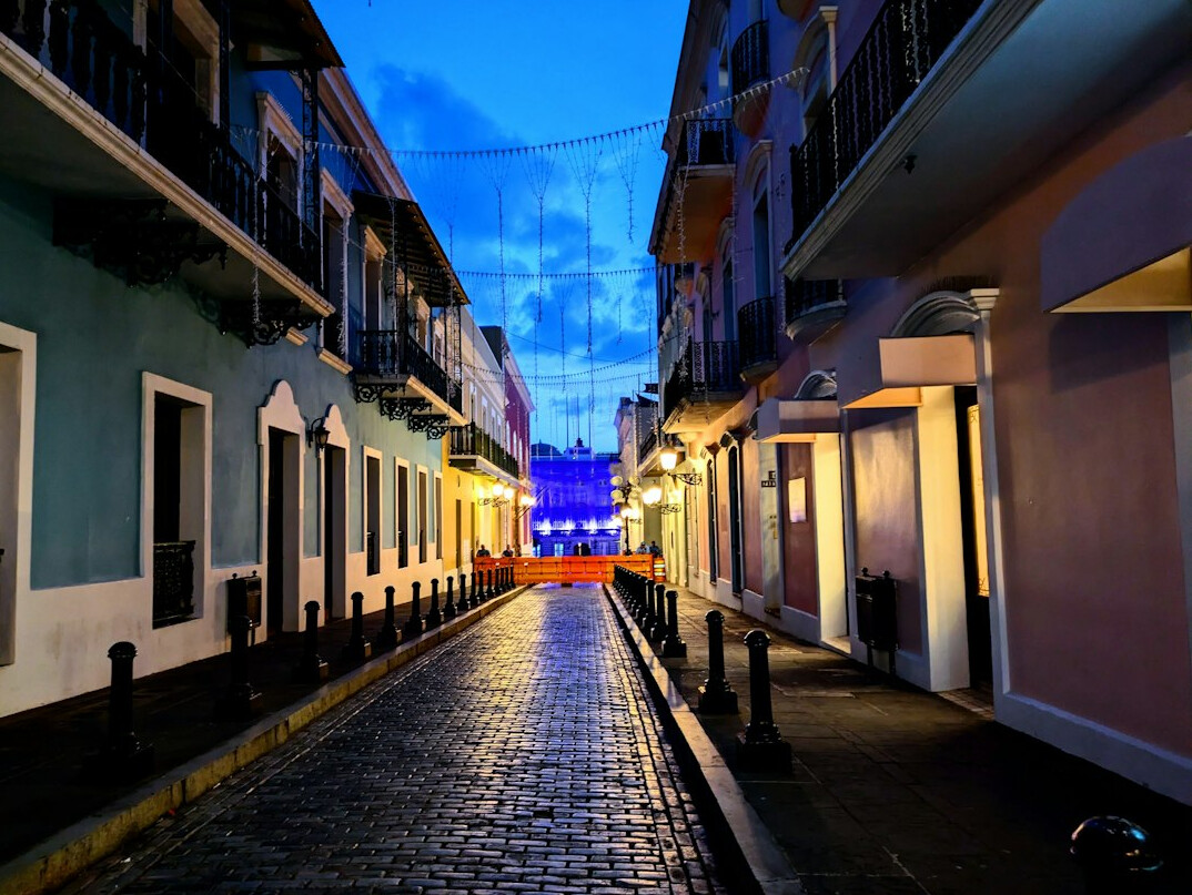 Old town street with colonial buildings at dusk