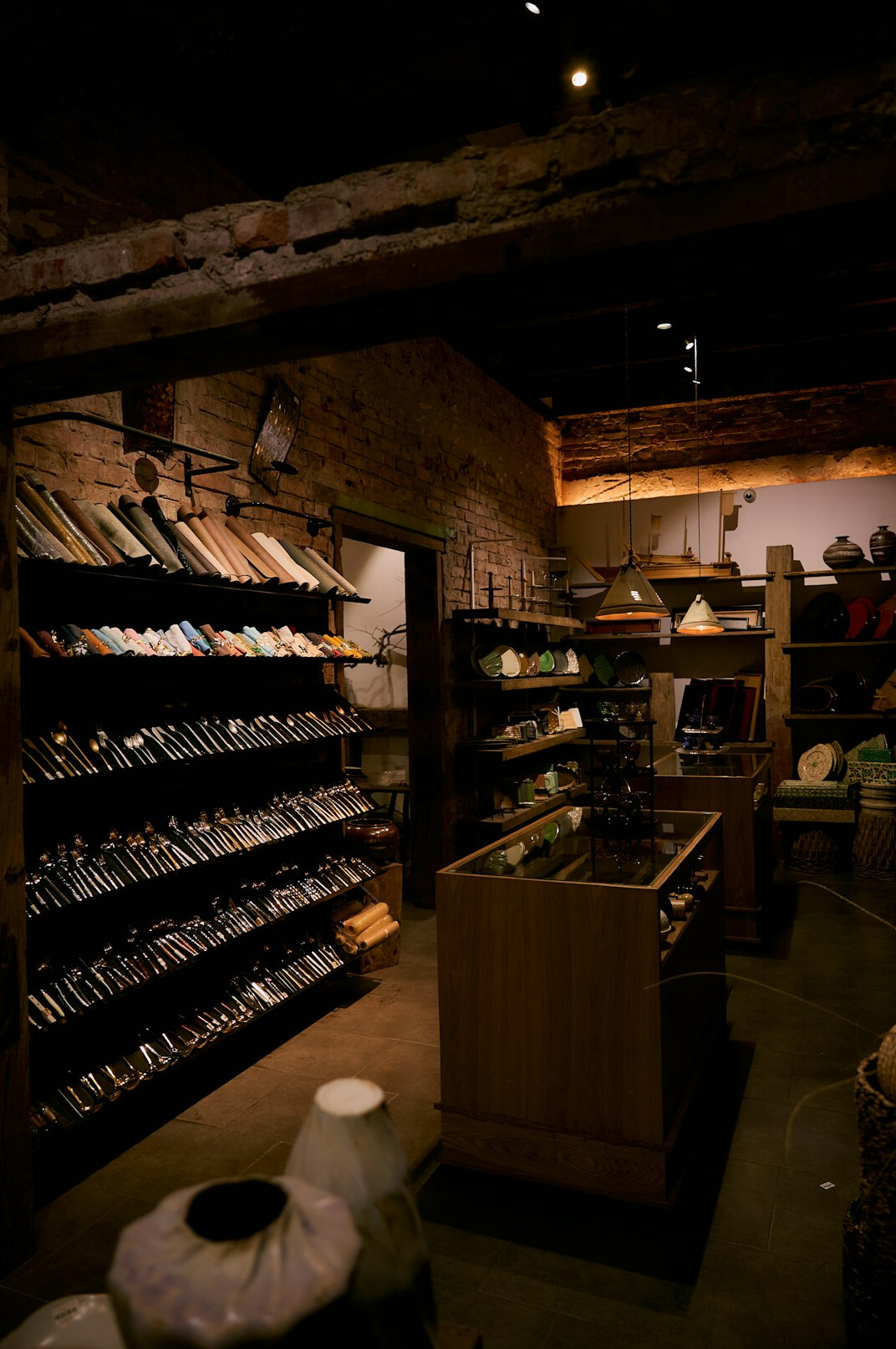Rows of old archive boxes and folders on wooden shelves